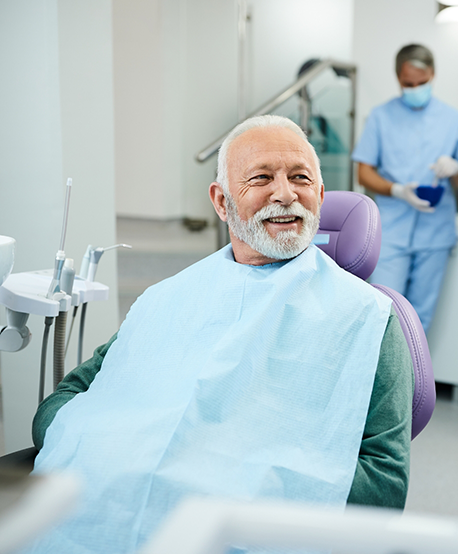 Older man smiling in the dental chair