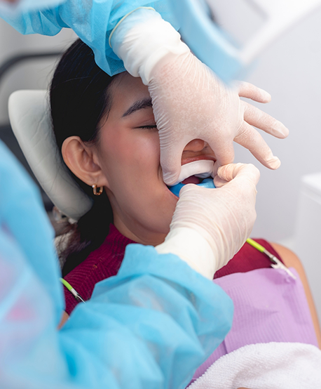 Dental patient having fluoride applied to their teeth