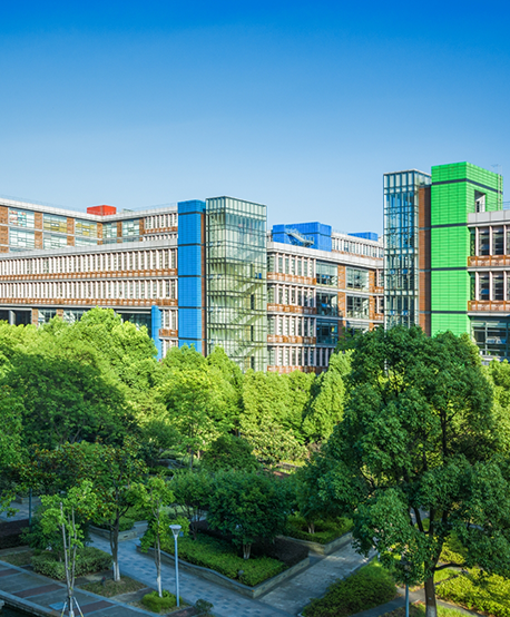 Small garden of trees in front of multistoried buildings on a university campus