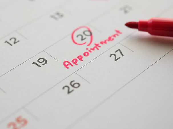 Calendar with the date of a dental appointment circled in marker