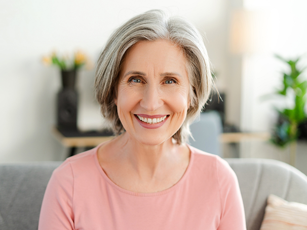 Smiling woman with her gray hair in a bob
