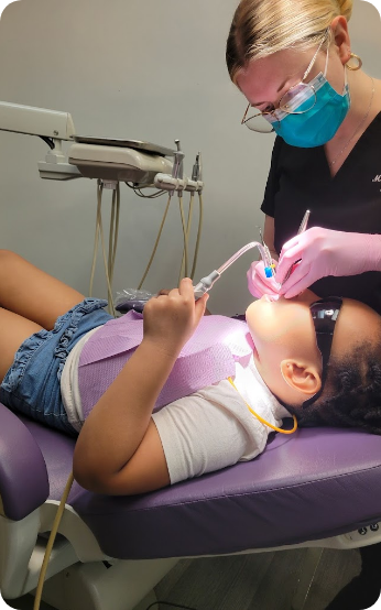 Young child receiving a dental cleaning
