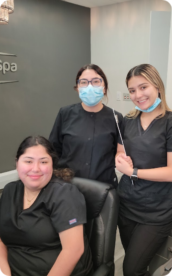 Three smiling Westbury Dental Spa team members