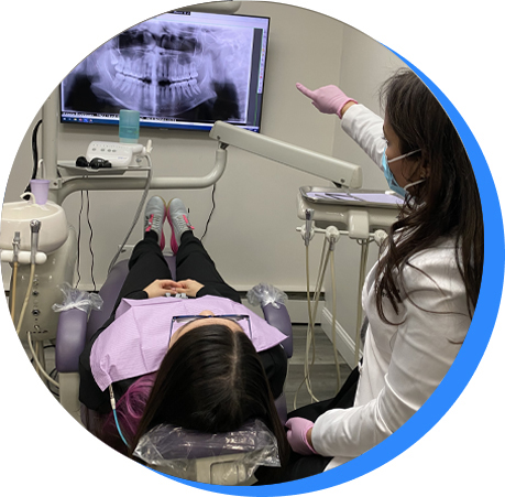 Westbury dentist showing a patient her x-rays